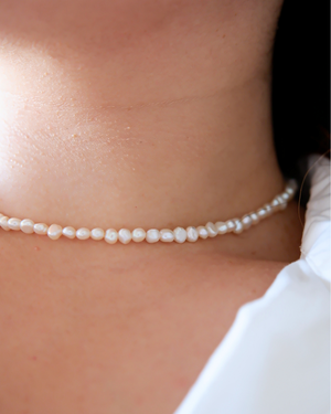 white pearl choker necklace.